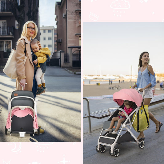 Woman carrying a baby and a folded pink pushchair, and another woman with a child in the pink pushchair on a promenade