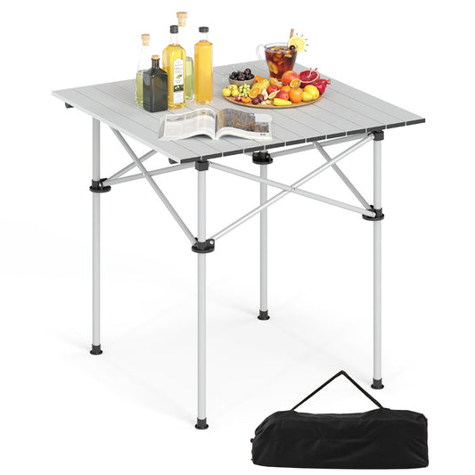 Folding Roll-up Aluminium Camping Table for 4 set up with bottles and fruit on top, with a black carry bag below