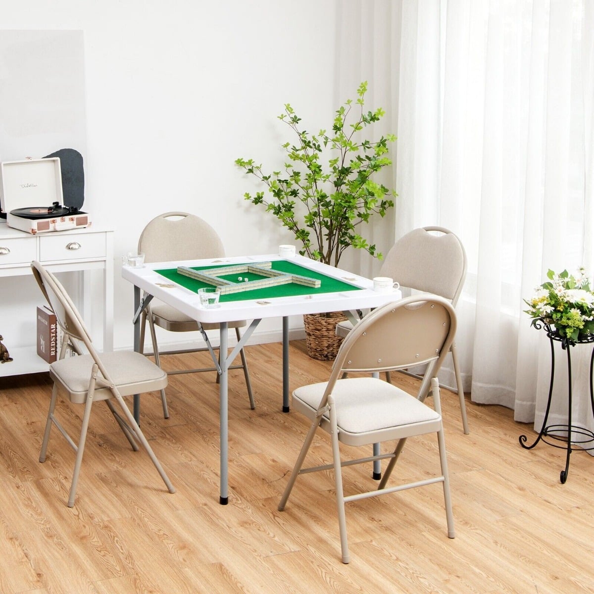 The game table set up in a bright room with four chairs arranged around it for playing