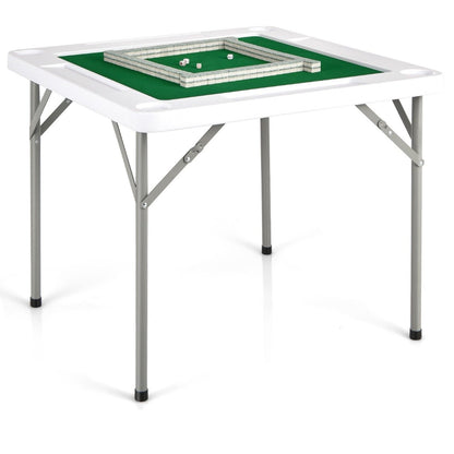 The game table with a set of tiles arranged in a square on the green playing surface