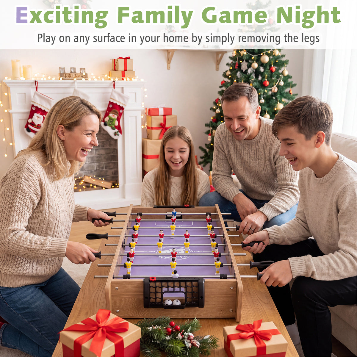 A family enjoying the foosball table in a living room setting at Christmas
