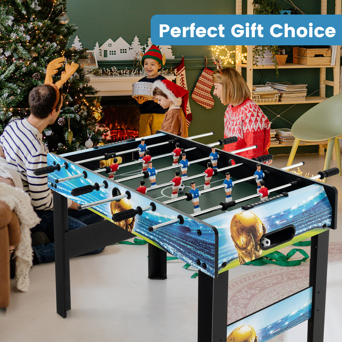 The football table set up in a living room decorated for Christmas