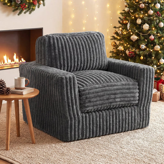 The grey boneless couch in a festive room with a fireplace and Christmas tree