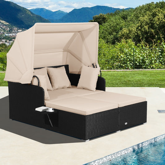 The rattan daybed with canopy is set up outdoors beside a swimming pool
