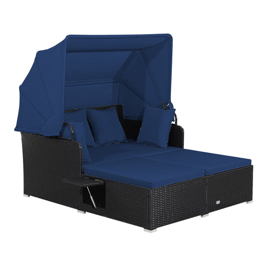 Garden Rattan Daybed with Retractable Canopy and Cushions in navy blue, shown with the canopy extended