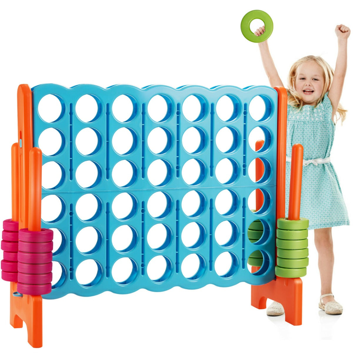 A young girl playing the giant four in a row lawn game with a green ring