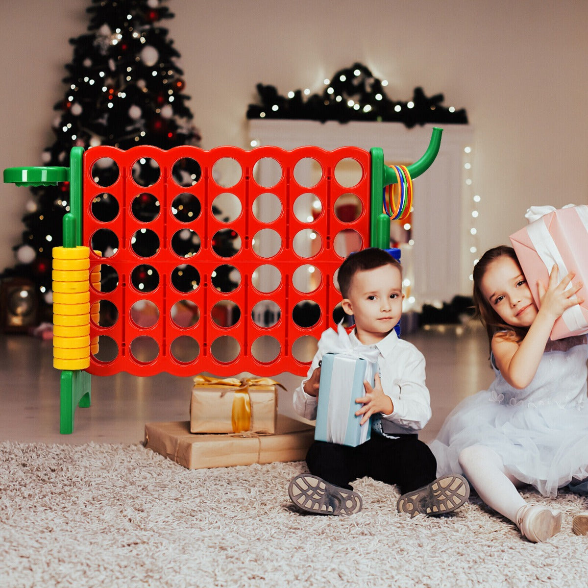 Children with presents playing the lawn game in a festive room