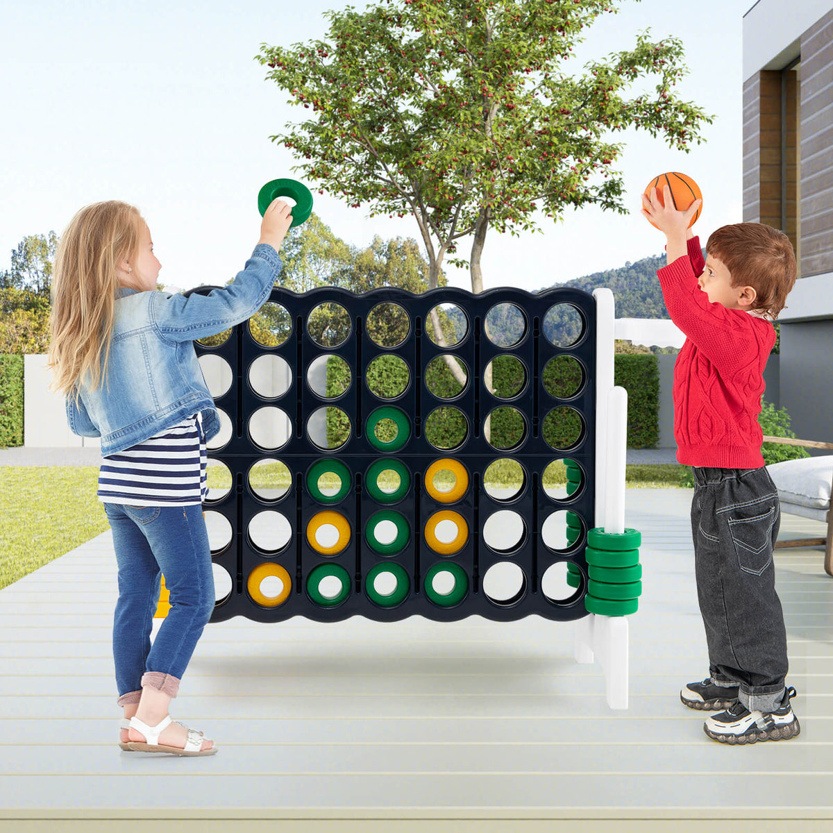 Children playing the lawn game outdoors on a patio