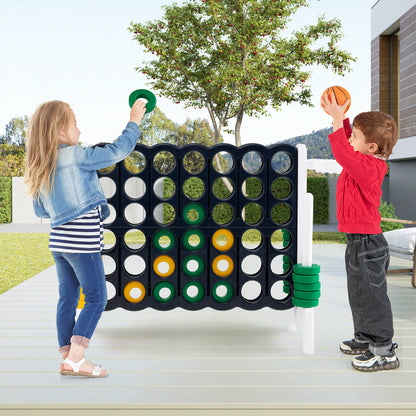 Children playing the lawn game outdoors on a patio