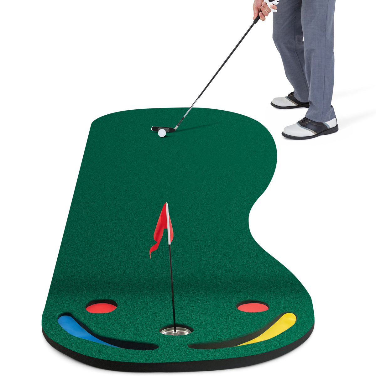 The putting green mat with a golfer using a club to hit a ball towards the hole