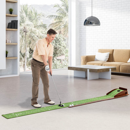 The golf putting mat training aid in use indoors with a man practising his putting