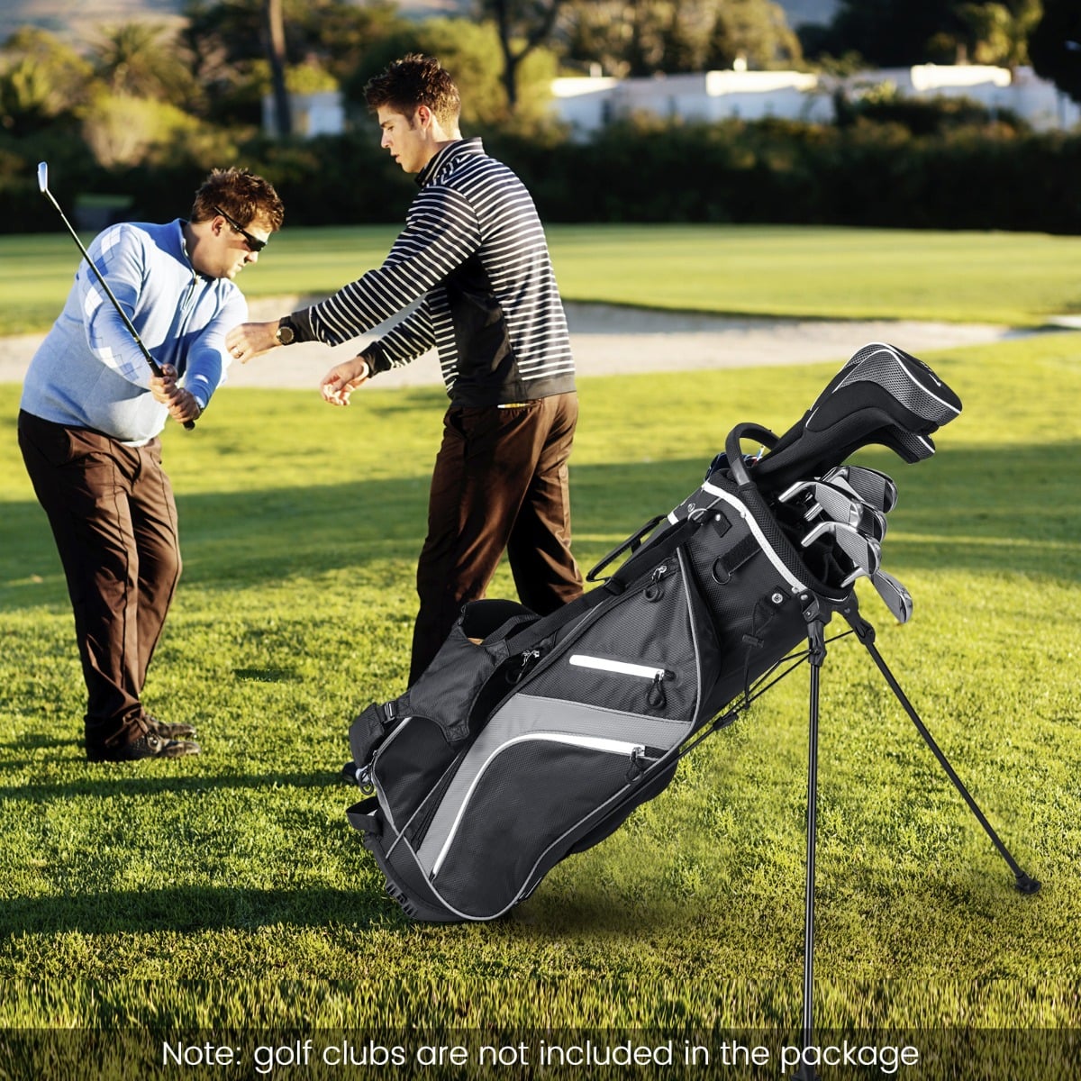 This golf stand bag in grey is shown on a golf course with two men nearby