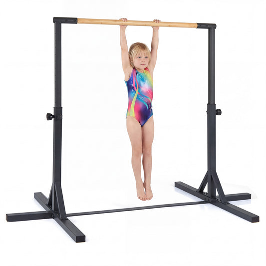 Gymnastics Bar with a young girl hanging from the wooden rail against a plain white background