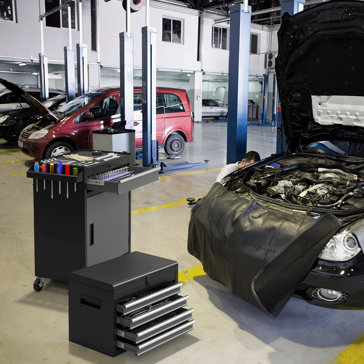 A mechanic using the tool storage cabinet in a car repair workshop
