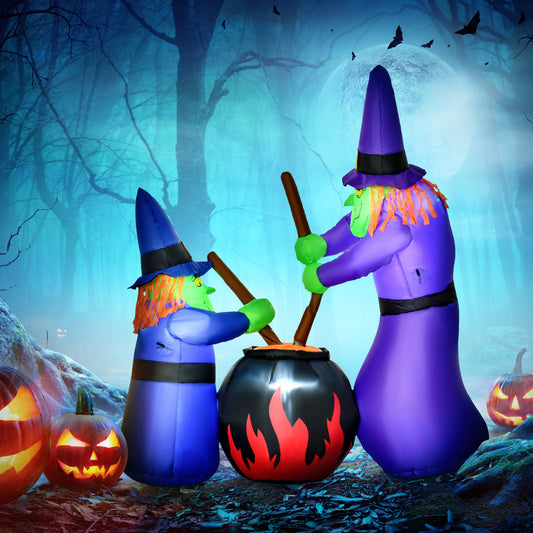 The halloween inflatable displayed in a spooky forest setting with glowing pumpkins at night