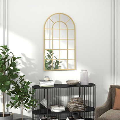 The wall mirror hanging above a black console table in a modern living room
