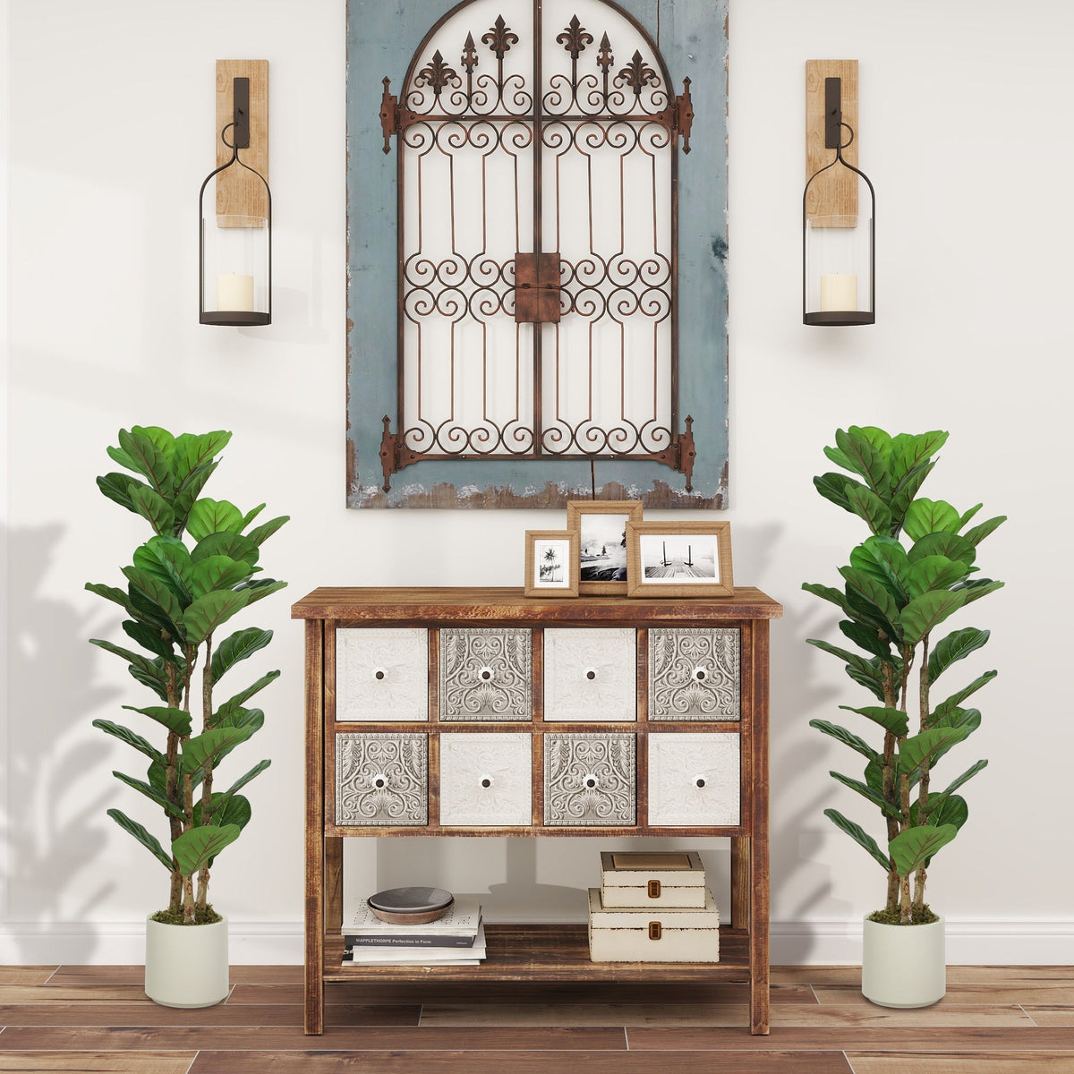 The artificial plants placed on either side of a wooden cabinet in a decorated living room