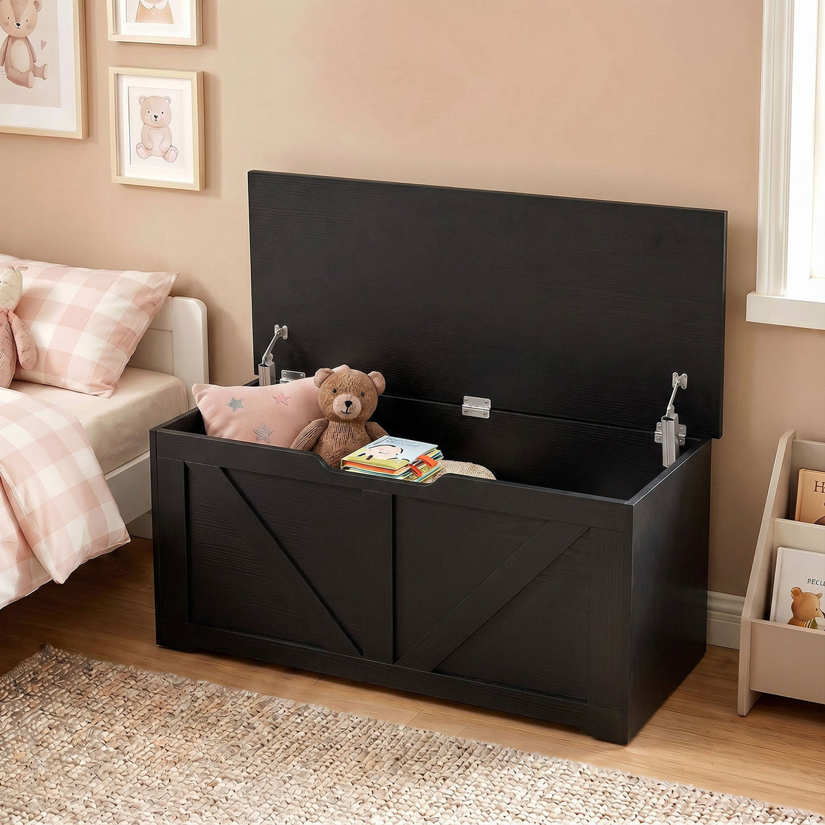 Black wood-effect storage box with lid open, in a child's bedroom with toys inside