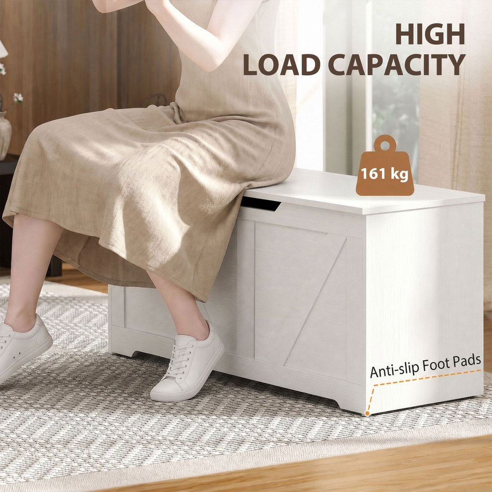 A person sitting on the storage cabinet, showing its load capacity