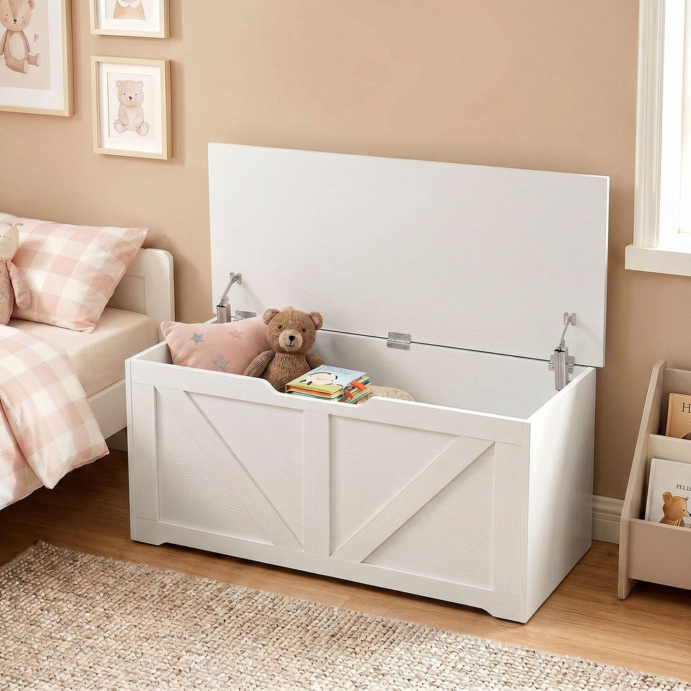 White wooden storage cabinet filled with toys and books in a child's room
