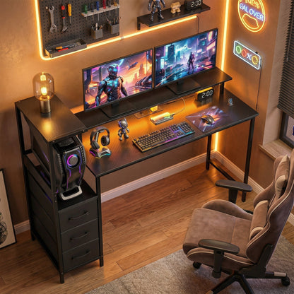 The computer table set up in a gaming room with two monitors and RGB lighting