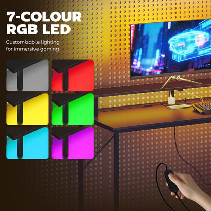Gaming desk with customizable RGB LED lighting options in red, green, blue, and purple