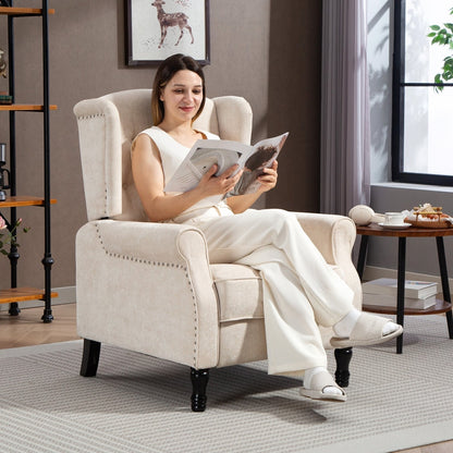 Woman reading a magazine while sitting in the beige reclining armchair in a living room