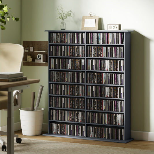 The grey media storage unit filled with various music discs placed in a home office setting