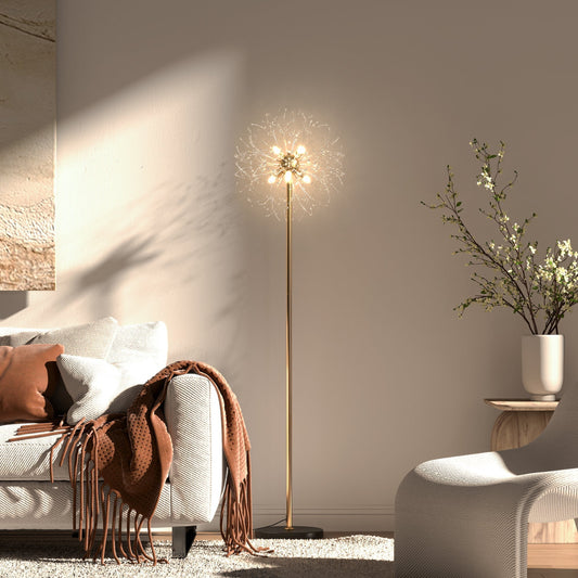 The floor lamp illuminated in a cosy living room next to a sofa and a chair