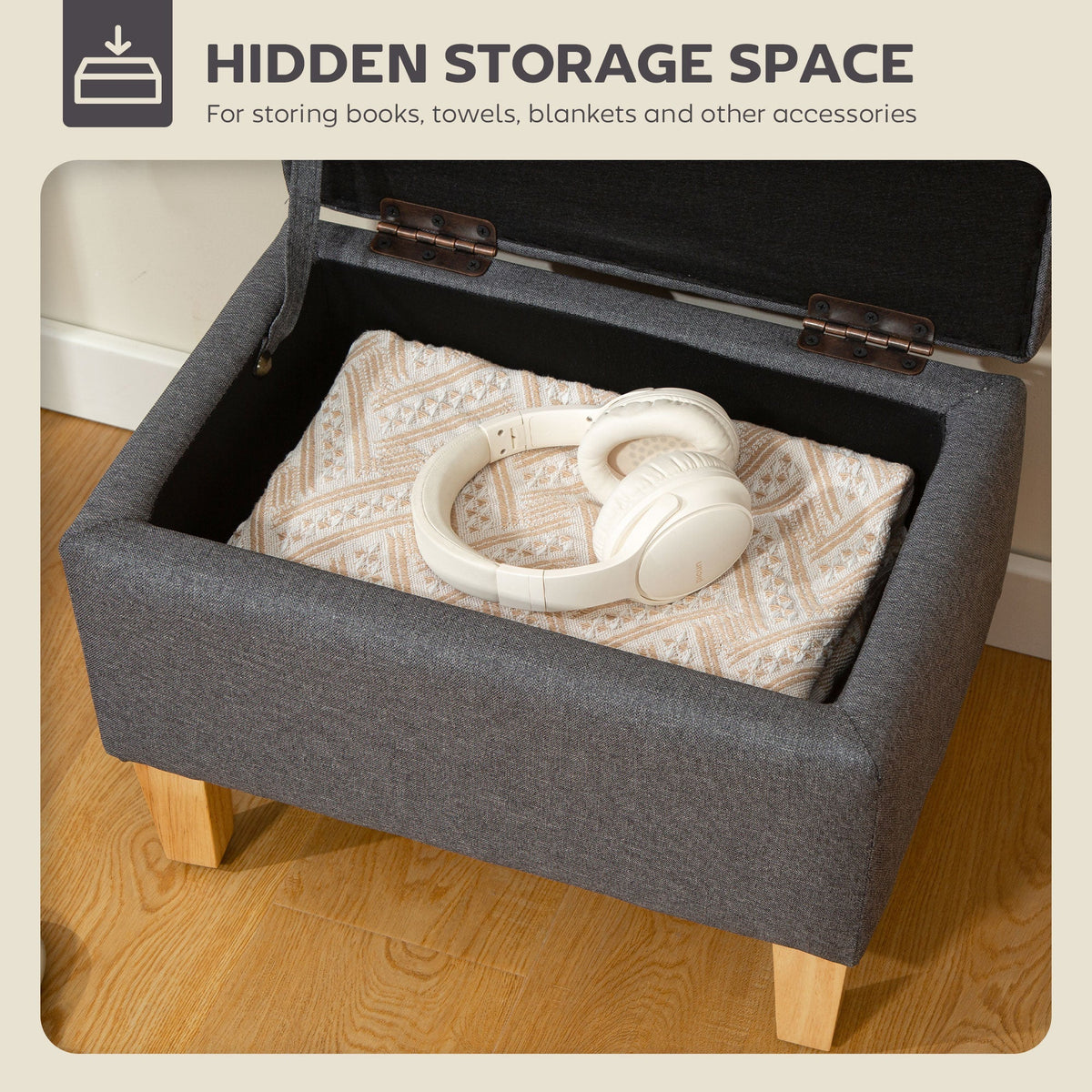 The open storage ottoman reveals a hidden storage space for blankets and headphones