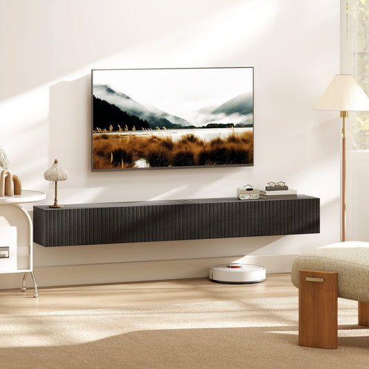 The wall mounted TV unit in a modern living room with a TV above it