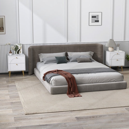 Two white bedside cabinets with gold legs in a bedroom setting