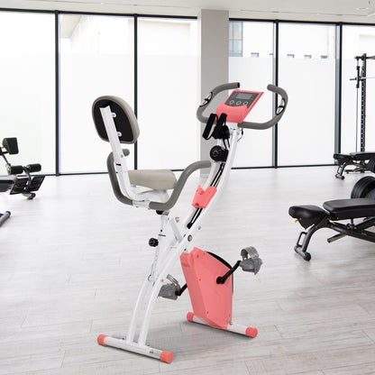 Pink exercise bike in a bright gym room with other equipment