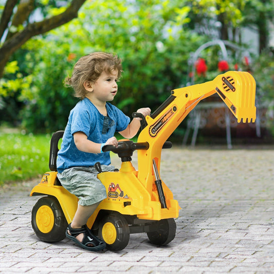 A young child sits on the yellow ride on tractor pulling cart in a garden setting