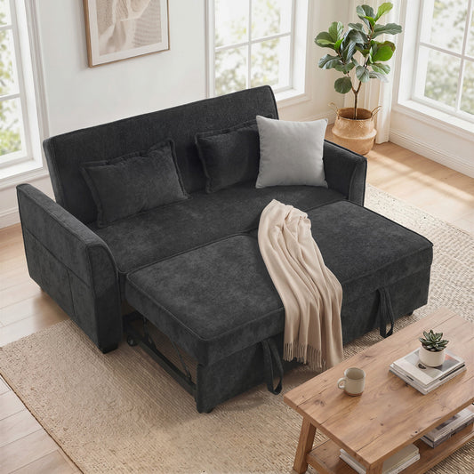 The dark grey sofa bed is shown in a living room setting with a throw blanket draped over it