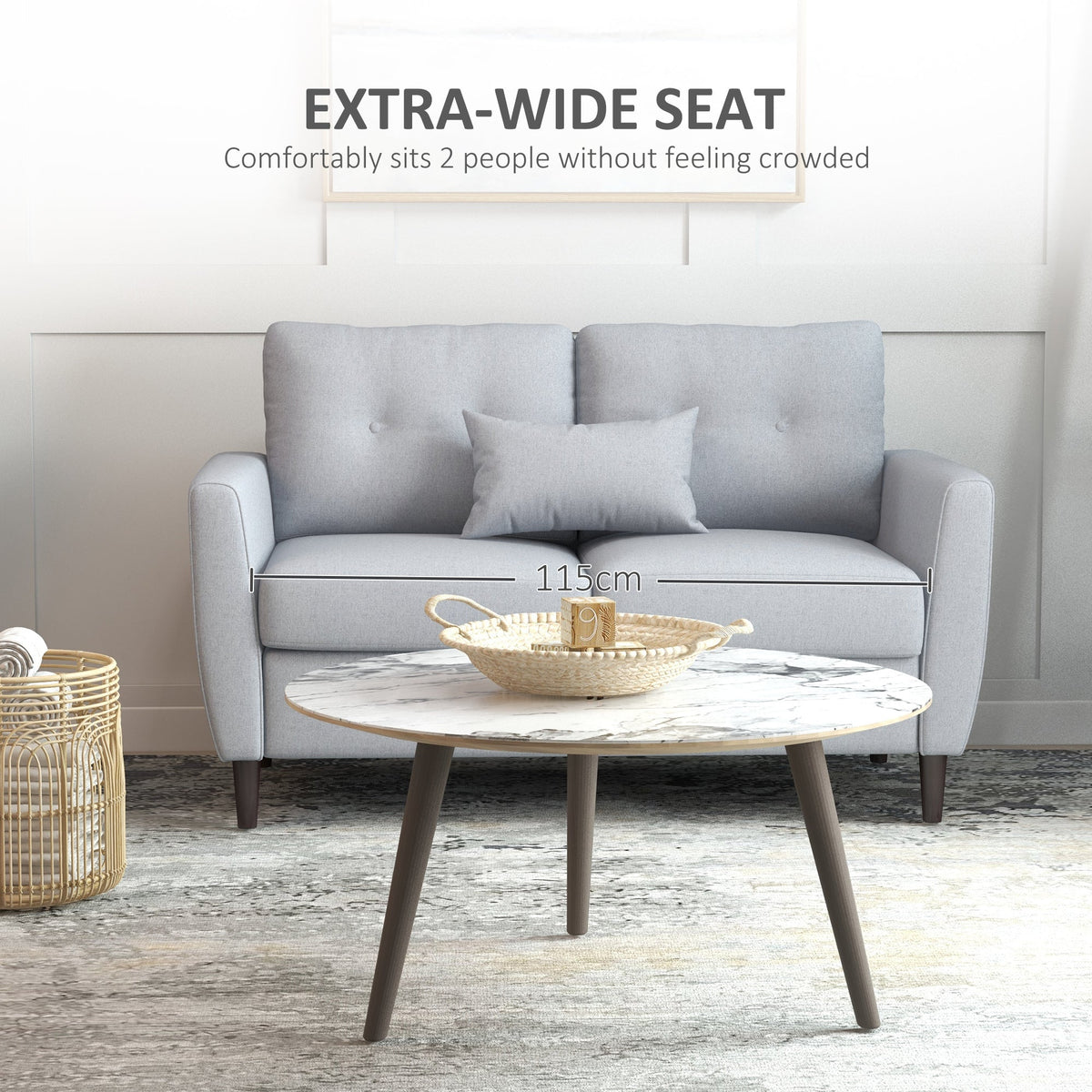 Extra wide seat of the light grey fabric two seater sofa shown with a coffee table