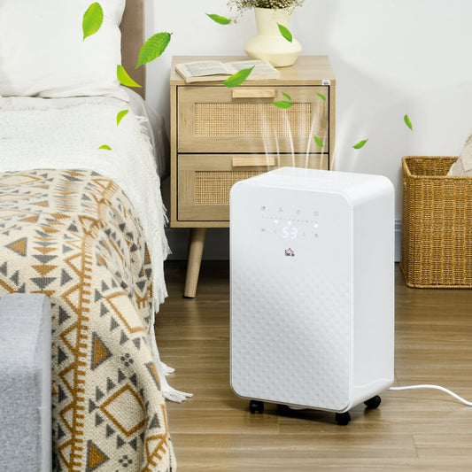 The portable dehumidifier with air purifier in a bedroom next to a bed and nightstand