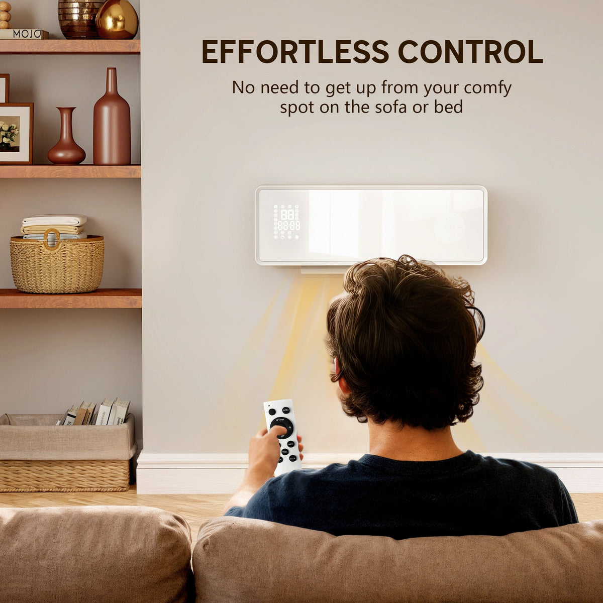 Man using the remote control to operate the wall mounted electric heater