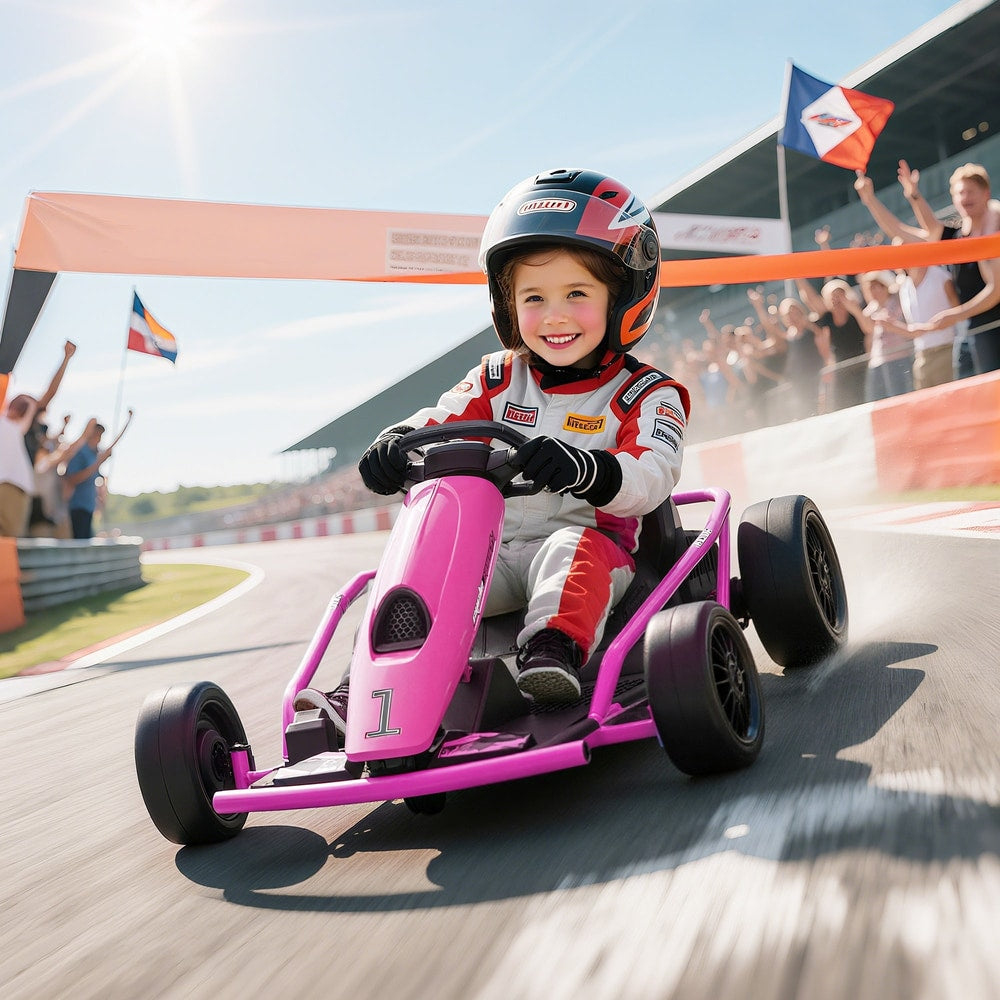 A young child wearing a racing suit and helmet driving the pink ride-on car on a race track