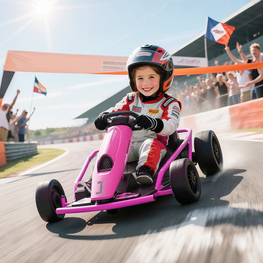 A young child wearing a racing suit and helmet driving the pink ride-on car on a race track
