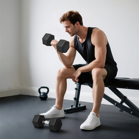 A man is lifting a rubber hex dumbbell while sitting on a bench in a home gym