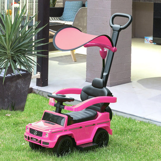 Pink ride-on push car for toddlers in a garden setting