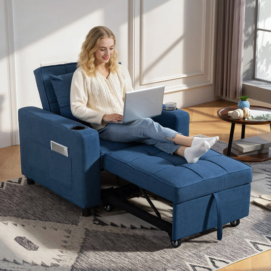 The convertible sleeper chair extended into a lounger with a person sitting on it using a laptop