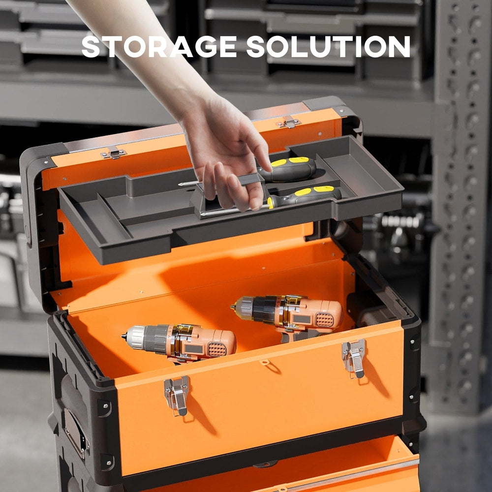 A hand places a screwdriver into the top compartment of the orange tool box