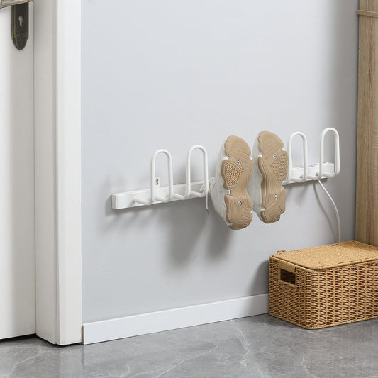 The electric shoe dryer mounted on a wall with a pair of trainers hanging on it