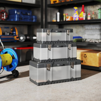 Three stainless steel tool boxes of varying sizes stacked together on a carpeted floor
