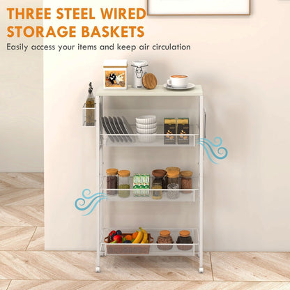 White kitchen trolley with three wire baskets, holding plates, jars and fruit