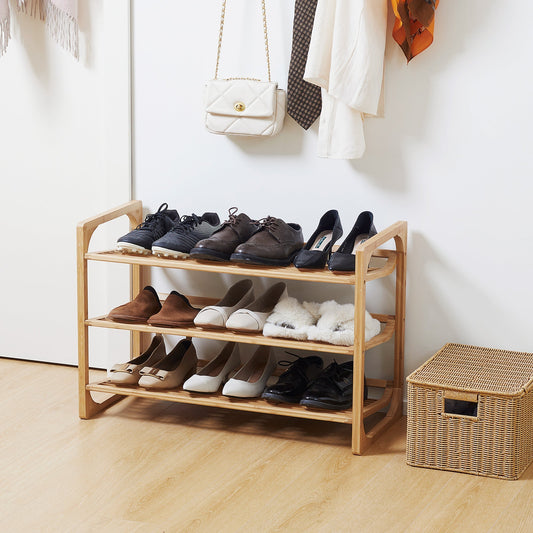 the shoe storage filled with various footwear in a bright hallway