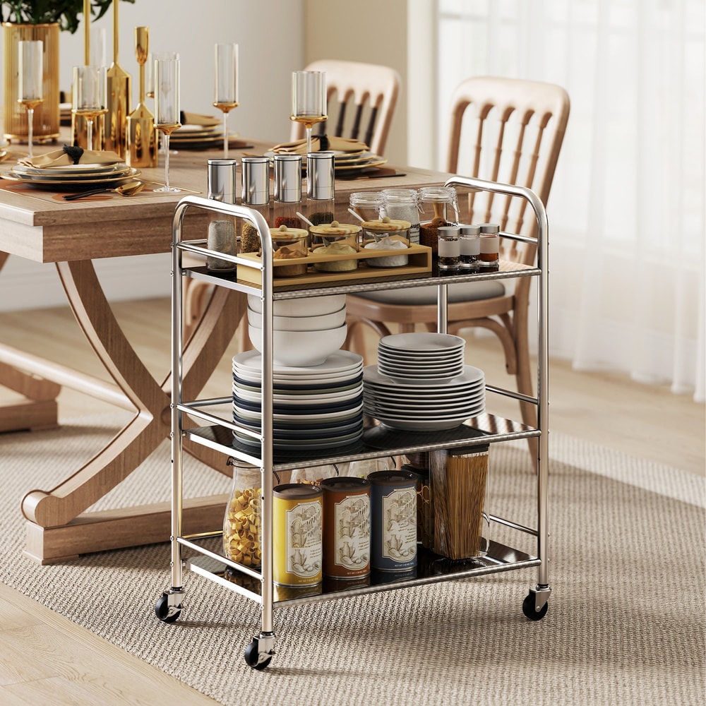 Kitchen storage trolley with plates, jars and cans on its shelves in a dining room
