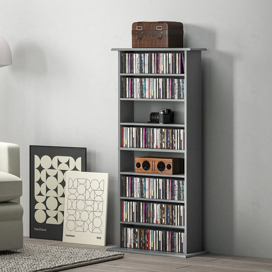 The tall grey shelving unit filled with music discs and decorative items in a living room
